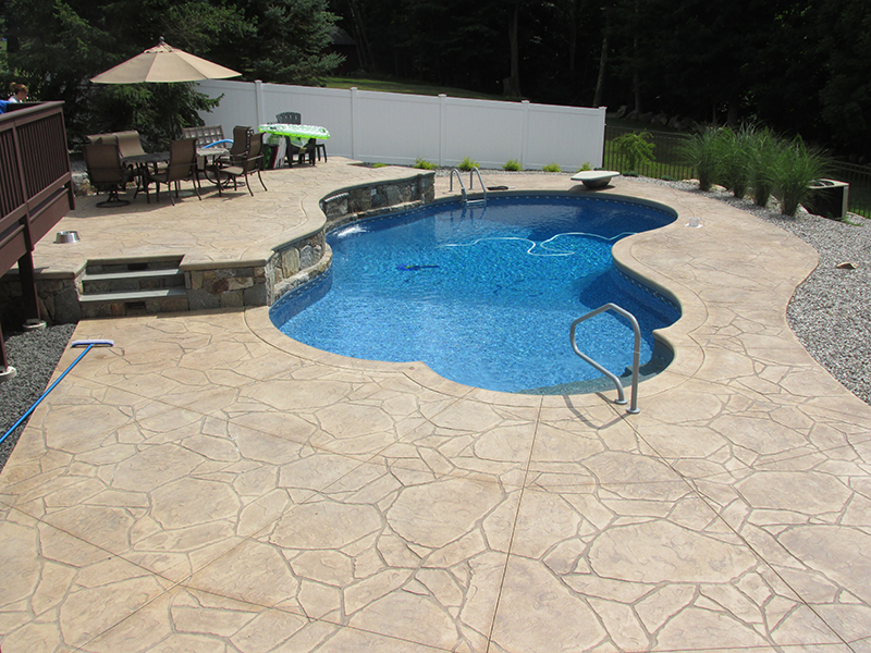 Swimming pool and stamped concrete project example 195